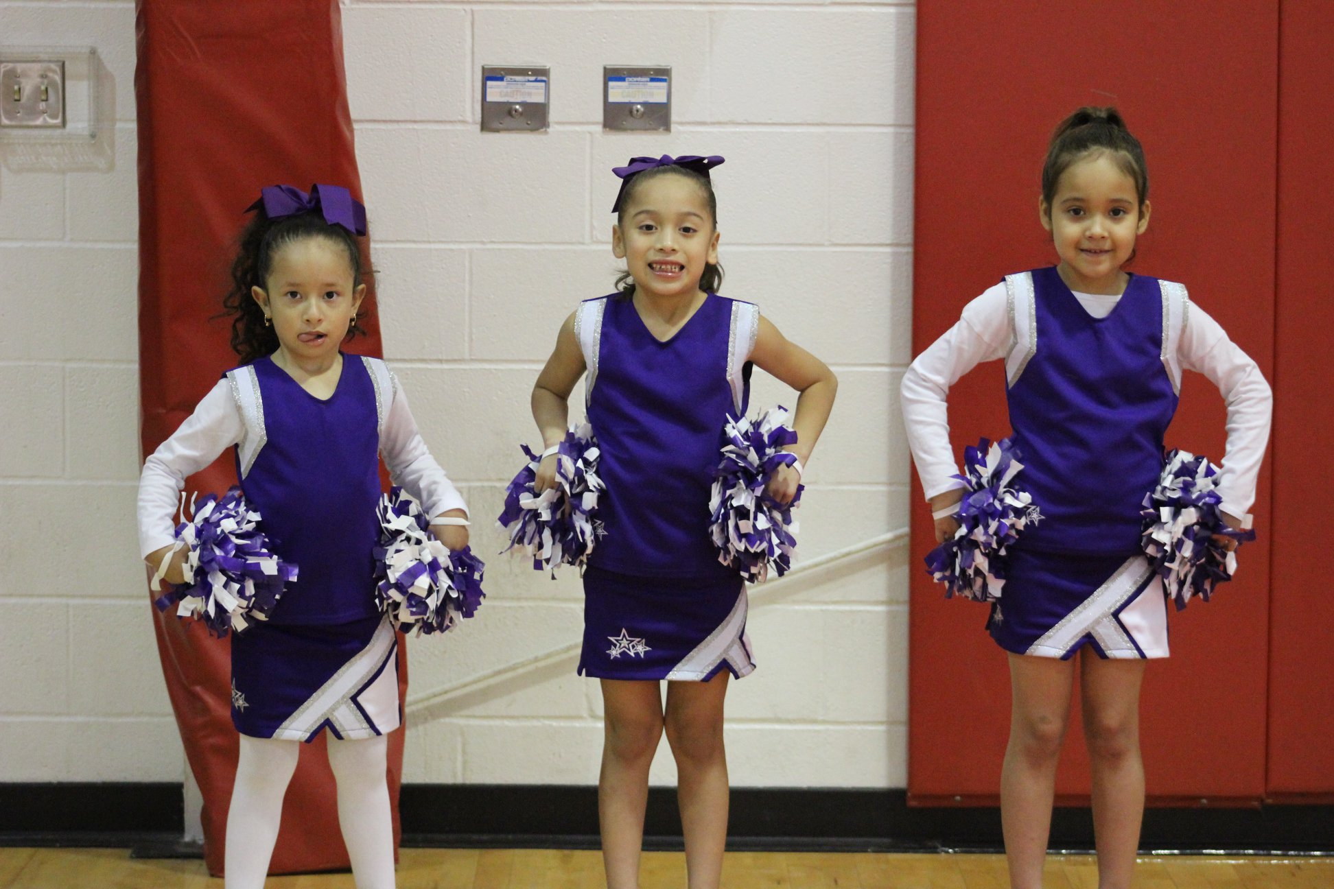 Youth cheerleaders posing.