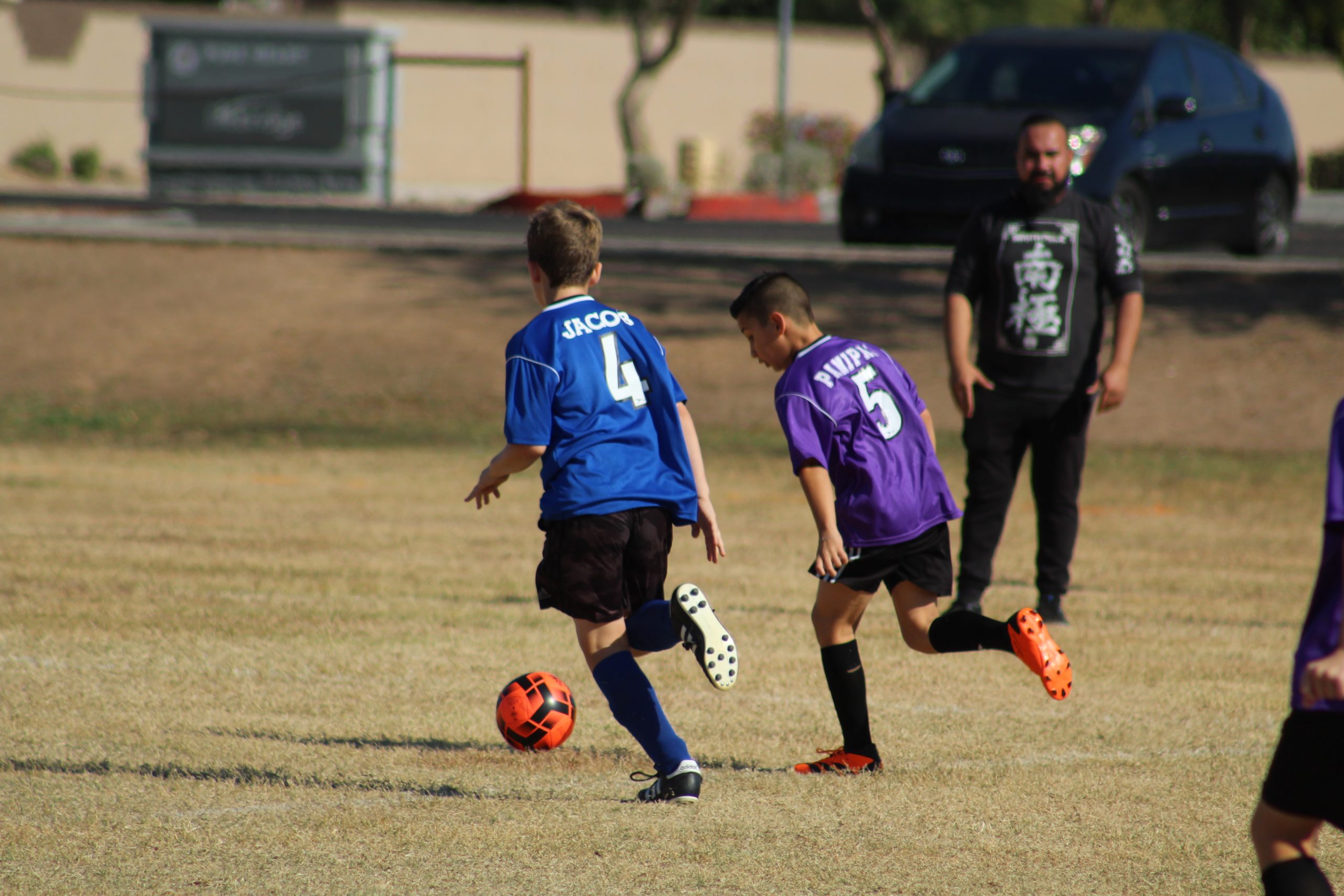 Youth soccer players being coached.