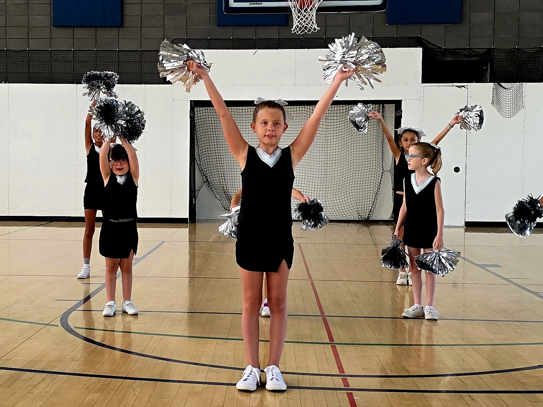 Youth cheer team in action.